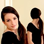 Pic of Ponytailed brunette enjoys hardcore fingering next to a mirror - IamXXX.com
