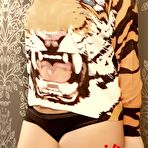 Pic of Redhead Lucy Vixen getting topless