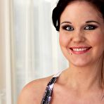 Pic of Slightly awkward brunette with a great tan showing off her goodies - IamXXX.com