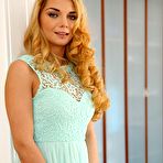 Pic of Wavy-haired and exotic-looking blonde teasing her dripping pussy - IamXXX.com