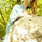 Pic of Forest nympho blonde showing off her naked body next to ancient rocks - aMetart.com