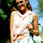 Pic of Shorts-wearing tanned seductress showing her feet and pussy outdoors - aMetart.com