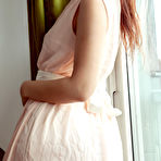 Pic of Ponytailed beauty with a perky booty posing and drinking tea - aMetart.com