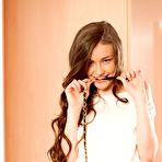 Pic of Busty wavy-haired beauty lifts up her skirt to make her intentions clear - aMetart.com