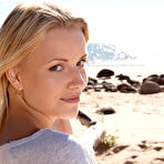 Pic of Playful blond-haired minx shows off that gorgeous ass while posing a beach - aMetart.com