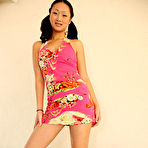 Pic of Petite pigtailed asian Evelyn Lin strips out of her short dress and gives footjob