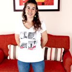 Pic of Lisandra strips naked on her red sofa - PussyFur.com