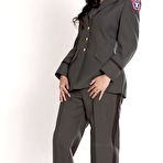 Pic of Black haired uniformed babe Betty Spark pleases four fat hard dicks at once