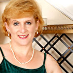 Pic of [All Over 30] Plump redhead granny modeling in dress before posing naked - IWantMature.com