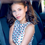 Pic of Brunette babe Hilary in pigtails displaying her pink panties in car at pussyxxxporn.com