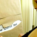 Pic of 
        Oldnanny.com - British granny Lacey Starr plays with doll Zara
    