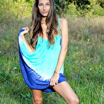 Pic of Free Kenya displays her petite body and meaty pussy on the grassy field.