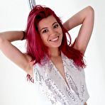 Pic of Redhead chick Sydney Mai is performing the Asian softcore nude dance at the pole