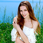 Pic of XXX Elle Tan bares her slender body as she playfully poses on the grass.met art patritcy 19