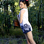 Pic of Exceptional slim brunette with delicate curves and small tits wearing white lingerie sensually undressing on a pink blanket in the woods. pics