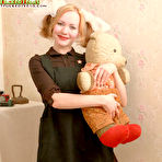 Pic of Sexy girl in a short dress teasing and stripping revealing her hot body before camera pics