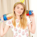 Pic of She sure knows how to make Friday night more exciting and chews on a bit of popcorn as she plays with her teen pussy. pics