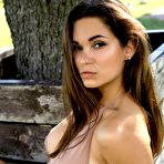 Pic of Busty young Faith with amazing ass poses outdoor