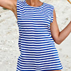 Pic of Nude In her striped beach dress and matching pigtails, Calli shows off her fun and playful appeal in a beach photo shoot