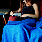 Pic of Nude Nerdy Sofi Shane flaunts her hairy snatch while reading on the chair.