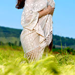 Pic of Nude Rosella flaunts her gorgeous body as she poses on the grassy field.