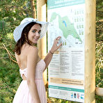 Pic of Nude Newcomer Oxana Chic shows off her sexy, tanned body as she strips outdoors.