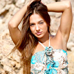 Pic of Nude Dominika A strips outdoors as she displays her delectable pussy.
