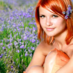Pic of Redhead Violla A bares her sexy, tanned body and smooth pussy in the meadows.