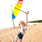 Pic of This petite teen blonde has her perfect little twat ready to have the sexiest beach walk in history. gallery