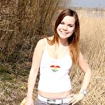 Pic of Hottest Very horny cutie fondling her pussy outside in the bushes by ShavedTeenGirls.com