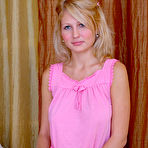 Pic of Lovely blonde girl proudly displays a set of her sweet breasts while posing on the bed. free pictures