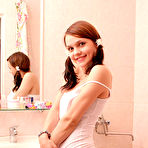 Pic of She have a passion for posing nude, this time she decided to undress in the bathroom - admire her fresh, slender body and innocent smile. free pictures