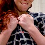 Pic of Tight bespectacled redhead Trinity Post gets naked to take golden shower