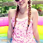 Pic of Hot redhead teen Dolly Little getting wet outside