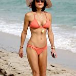 Pic of Bethenny Frankel in a peach bikini on a beach