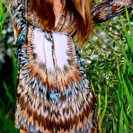 Pic of Seductive dress brunette revealing her smooth pussy in tall grass - aMetart.com