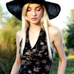 Pic of Kira W strips out of her sumptuous dress in the evening sun