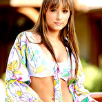Pic of Chelse Medley stripping flower top and pink thong by the pool
