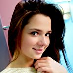 Pic of Lusty brunette teen in striped socks Kamilah A is playing her legs and showing shaved nub