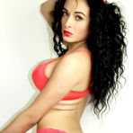 Pic of Blue Eyed Brunette in coral lingerie showing off her assets