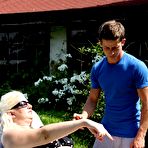 Pic of Mature blonde BBW face sits the neighbours boy after he applies suntan lotion - PornPics.com