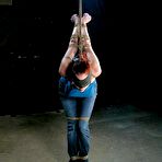 Pic of Rope tied redhead Mz Berlin with massive hooters gets her ass ruthlessly fucked