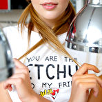 Pic of Monika Dee exposing her small tits and ass in the kitchen