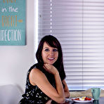 Pic of Andi Land flirting in a cafe in her sexy short dress