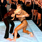 Pic of Clothed wrestlers Sharka Blue and Sarah Zafari getting oil drenched as they wrestle in oil