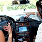 Pic of Busty Natalia Cruze and small titted Samantha get wet and horny after washing a car.