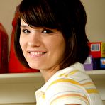 Pic of Naughty teenage girl Angie Dove strips and demonstrates her shaved snatch in the laundry room