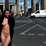 Pic of Round assed slave Harmony Rose appears totally nude in a crowded city train for Reinhard's pleasure