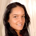 Pic of Classy brunette Latina Esmeralda strips black bra and rosy pantyhose to play with her nude body.