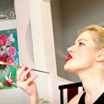Pic of 
A lady with strapon doing a guy

